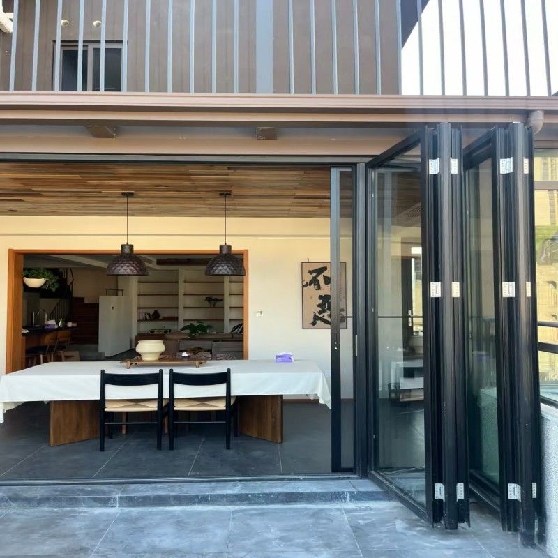 Porte en verre pliable en aluminium à rupture thermique haute performance à double vitrage pour espaces extérieurs